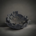 Coral Plate Set Black — two nesting charcoal-black faux coral pieces with a textured scalloped edge, HMT Home