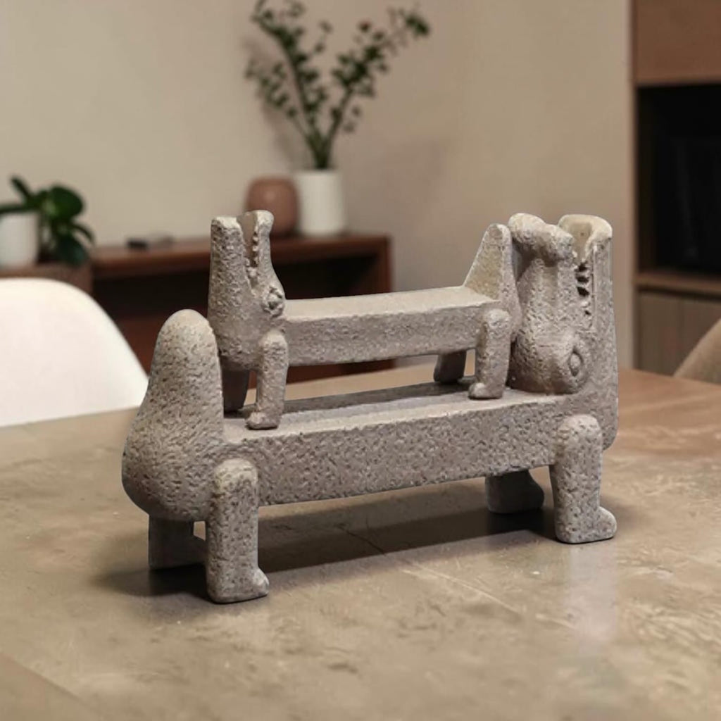 Croc Sculpture Set — two textured stone-finish crocodile sculptures, one resting on the other, on a stone countertop, HMT Home
