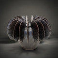 Fin Vase Small — pale grey ceramic vase with bronze metallic glazed fins fanning from the rim, HMT Home