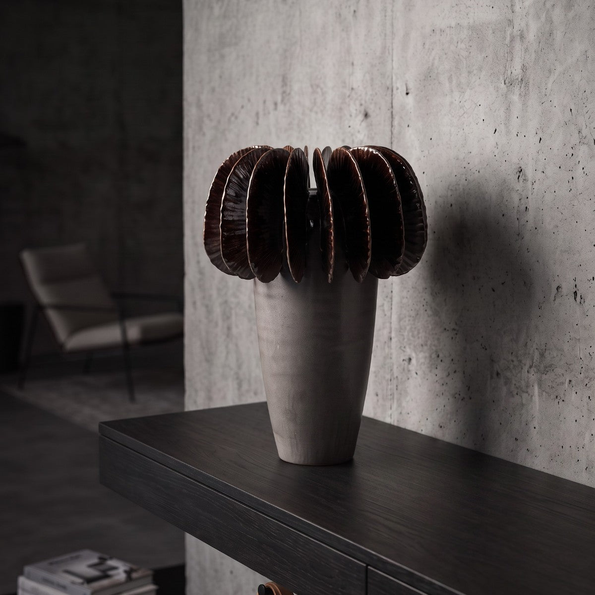 Fin Vase Large styled on a dark wood console — pale grey ceramic vase with bronze metallic glazed fins, HMT Home