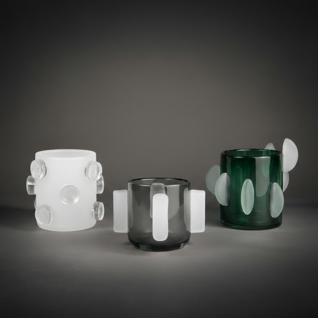 Bonnie, Kelly and Rosie vases together — frosted white, smoked grey and deep green glass with applied disc and handle details, HMT Home