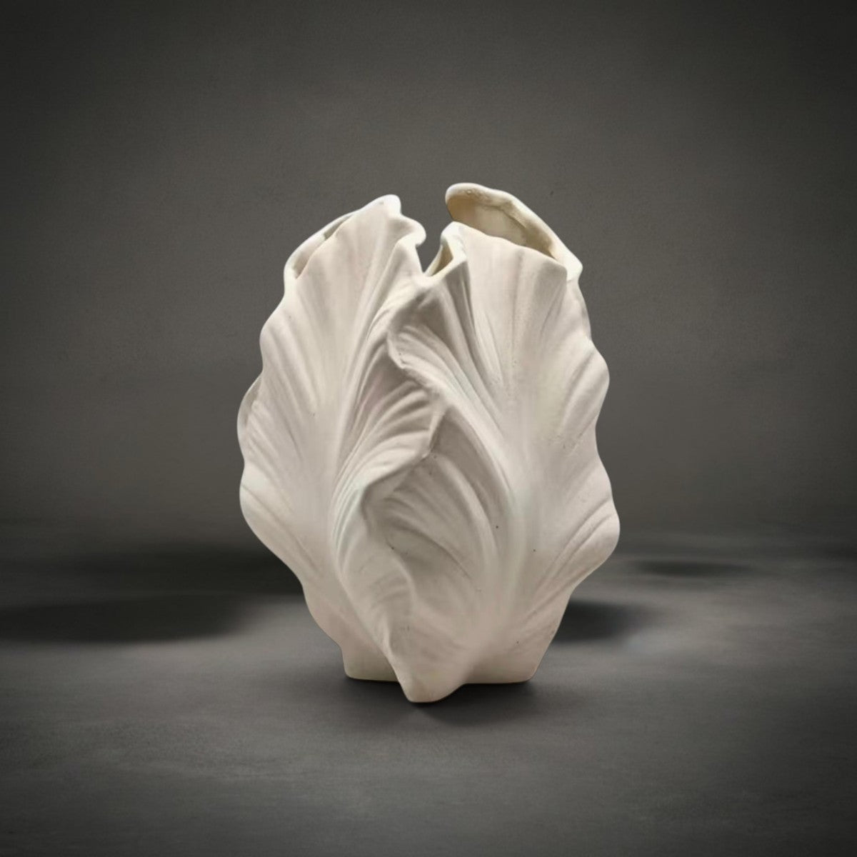 Leaf Vase — matte white ceramic vase sculpted from furled veined leaves, HMT Home