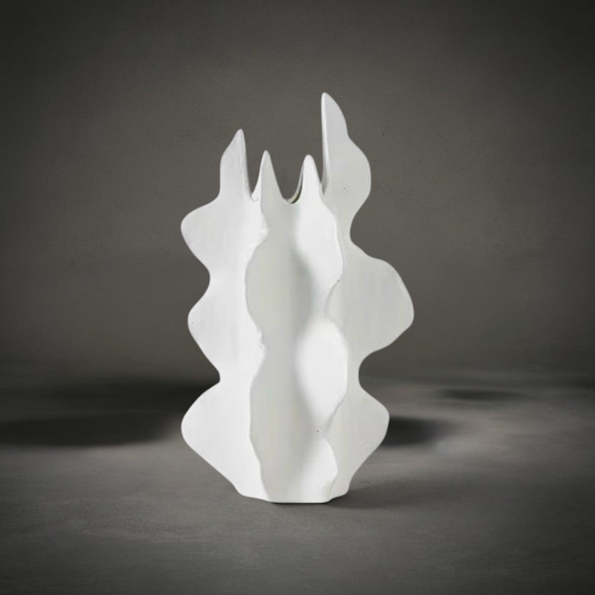 Wave Vase — white ceramic vase with an organic flowing wave-like silhouette, HMT Home
